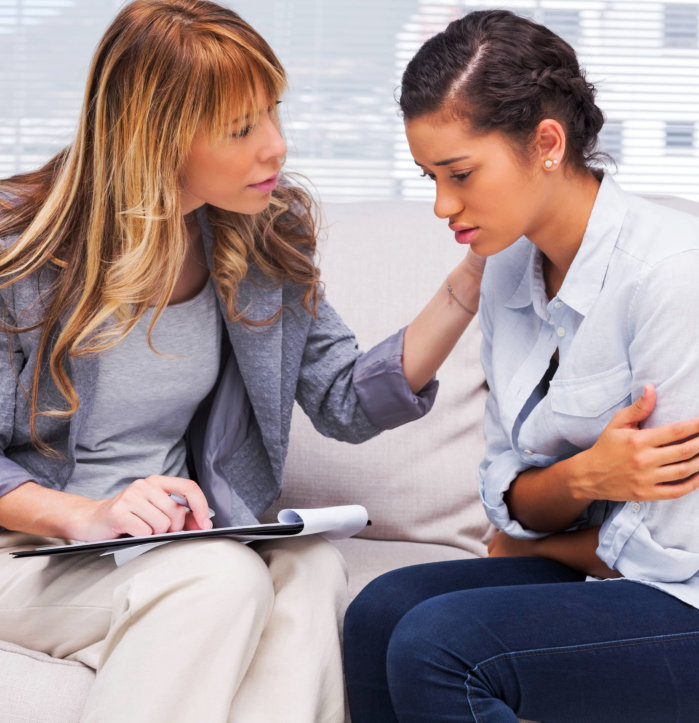 therapist comforts sad patient