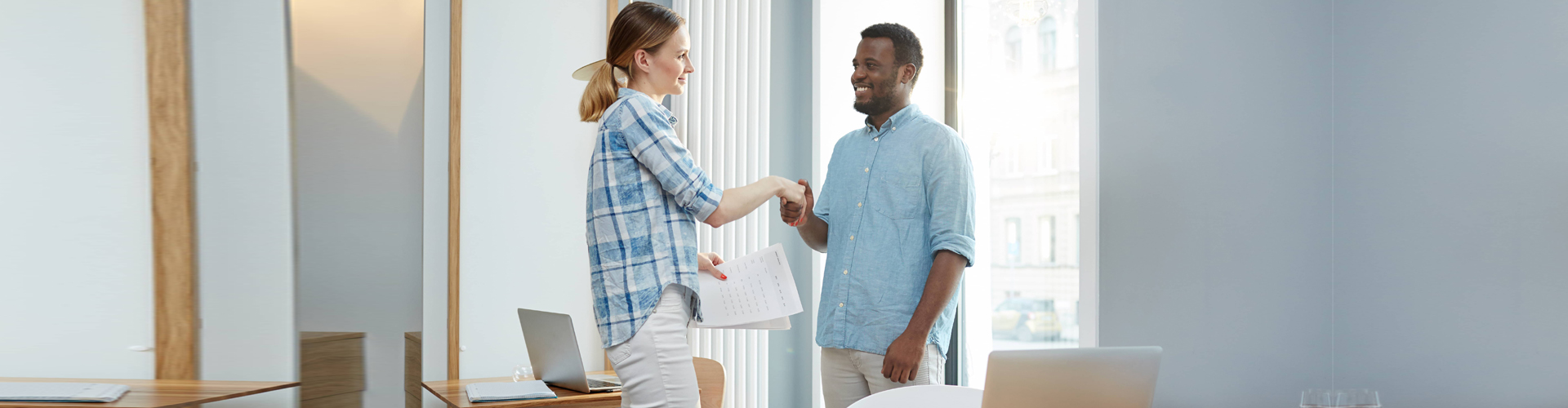 an employer and an applicant shaking hands