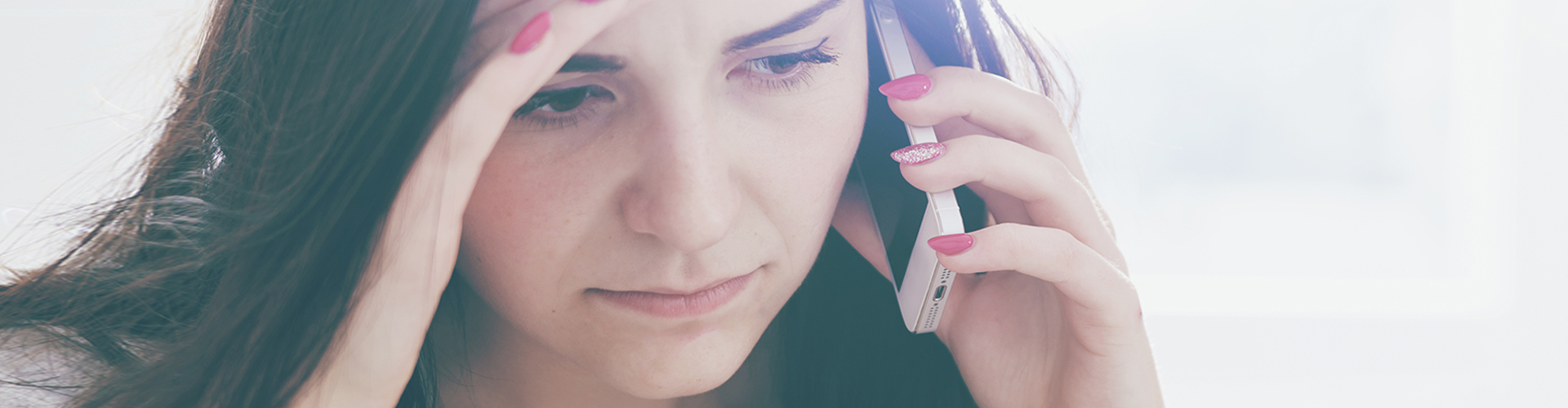 sad woman on phone